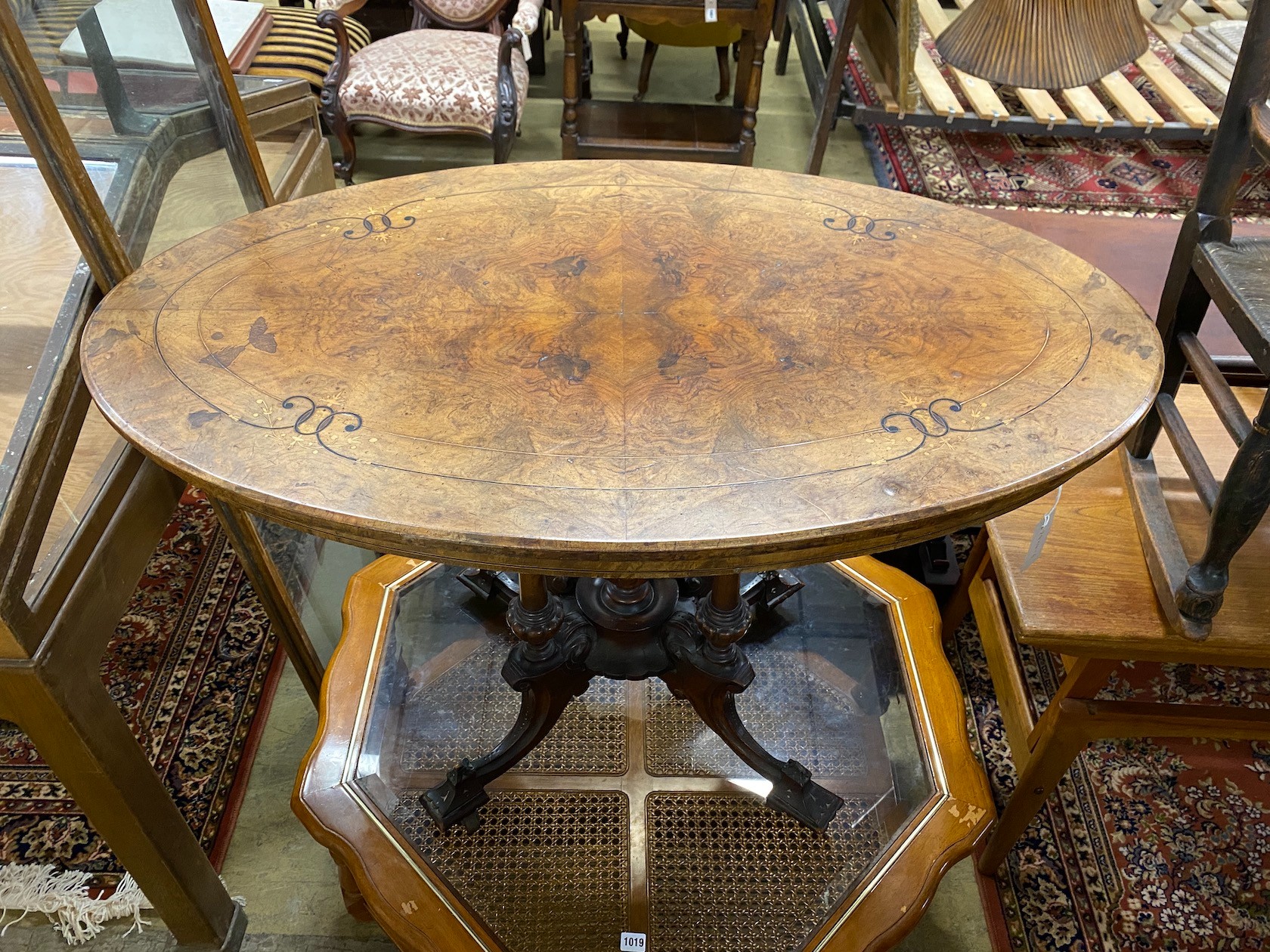 A Victorian inlaid walnut oval centre table, width 107cm, depth 64cm, height 72cm